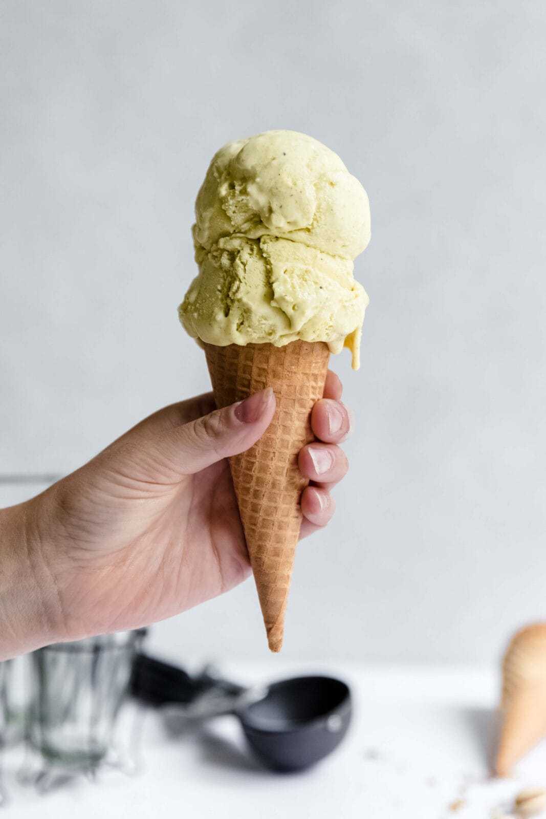 homemade pistachio ice cream in a cone