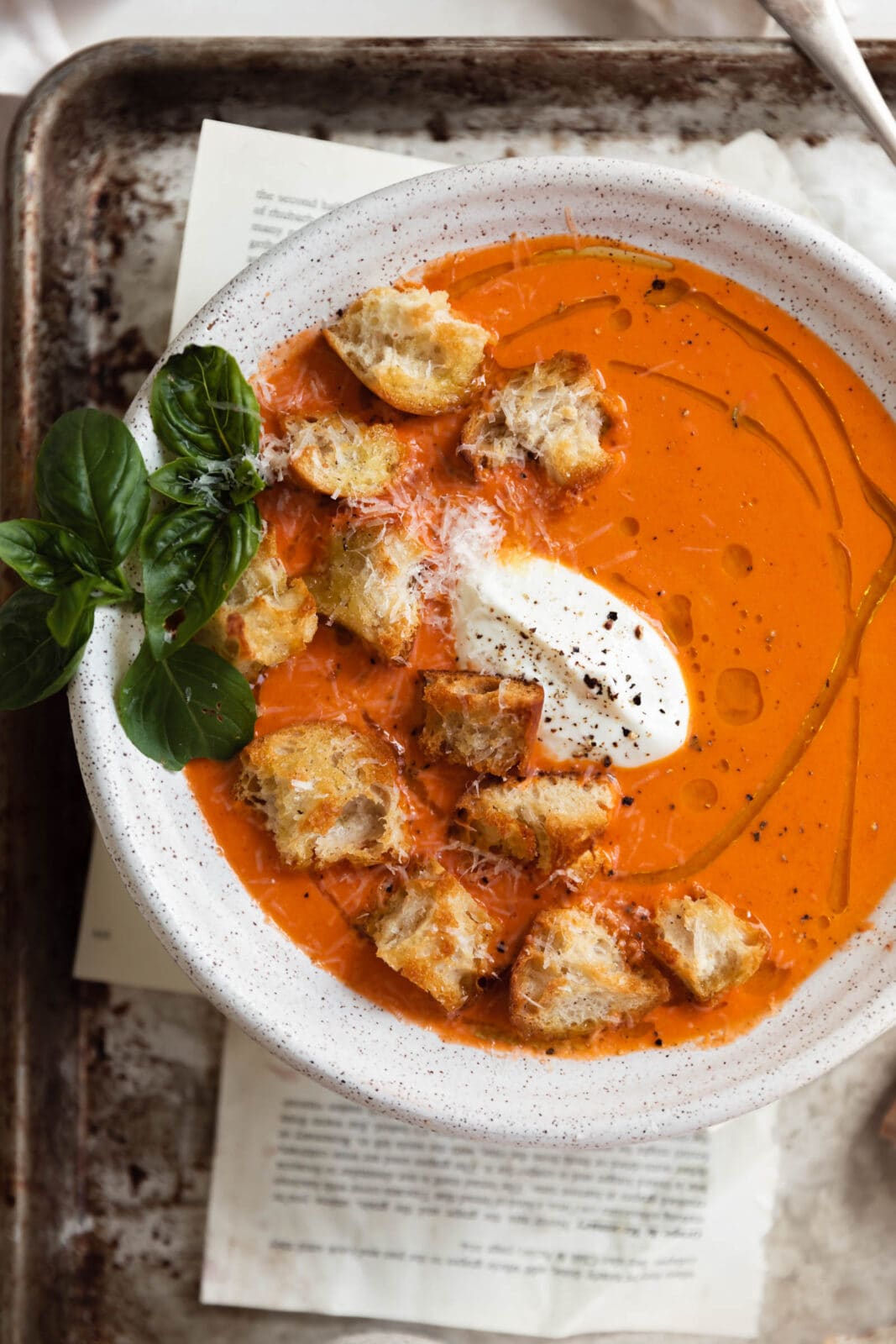 homemade tomato soup with croutons and olive oil