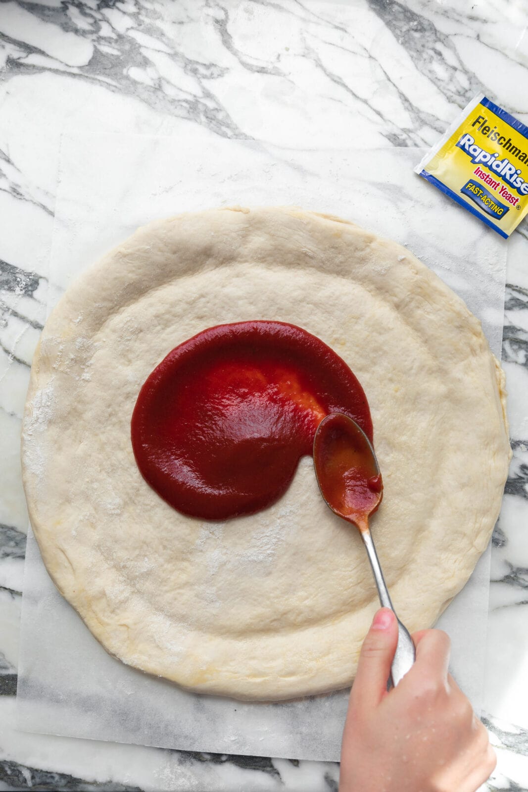 homemade pizza dough with sauce