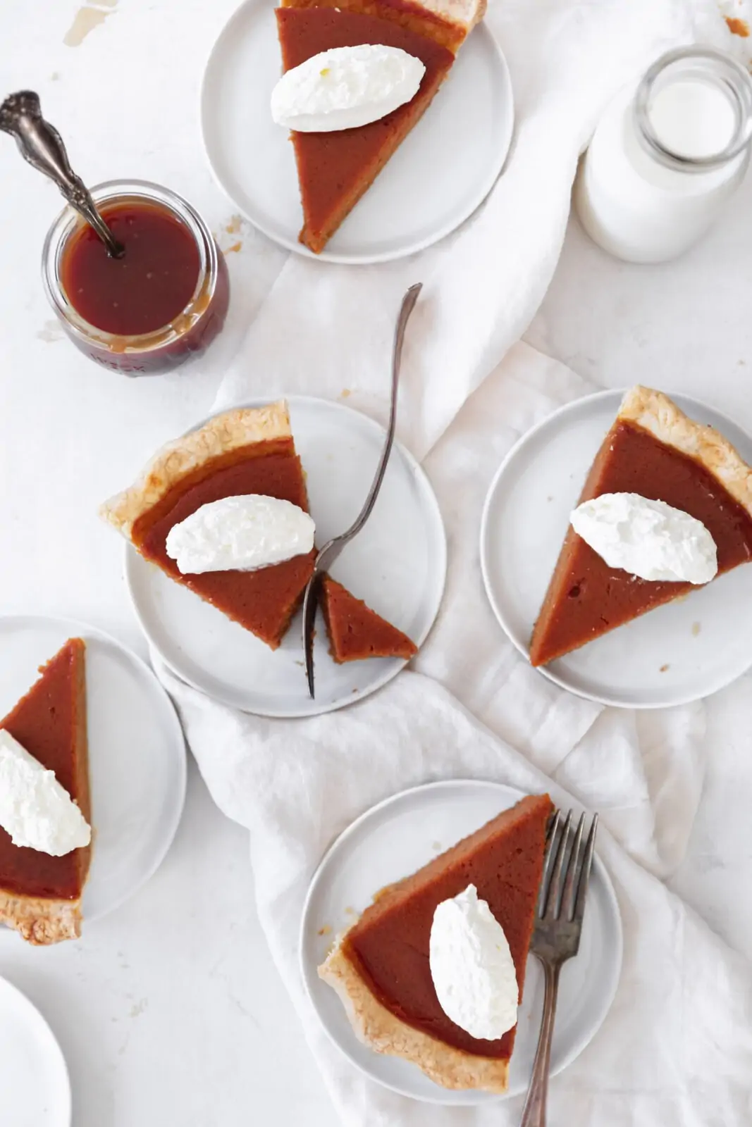 salted caramel pecan pie with whipped cream