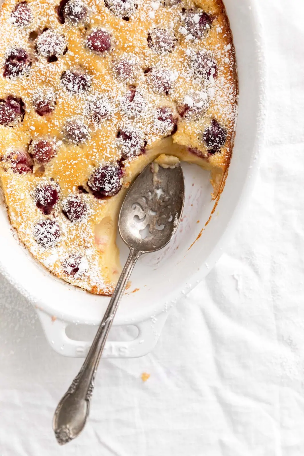 cherry clafoutis with a spoon