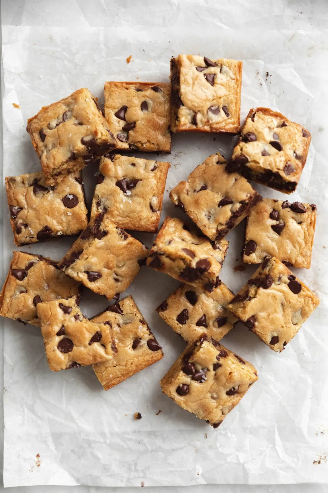 soft and chewy blondies on parchment paper