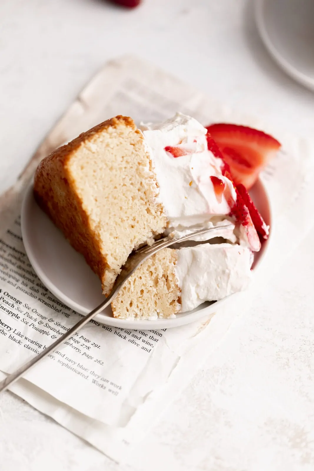 strawberry shortcake cake slice with whipped cream