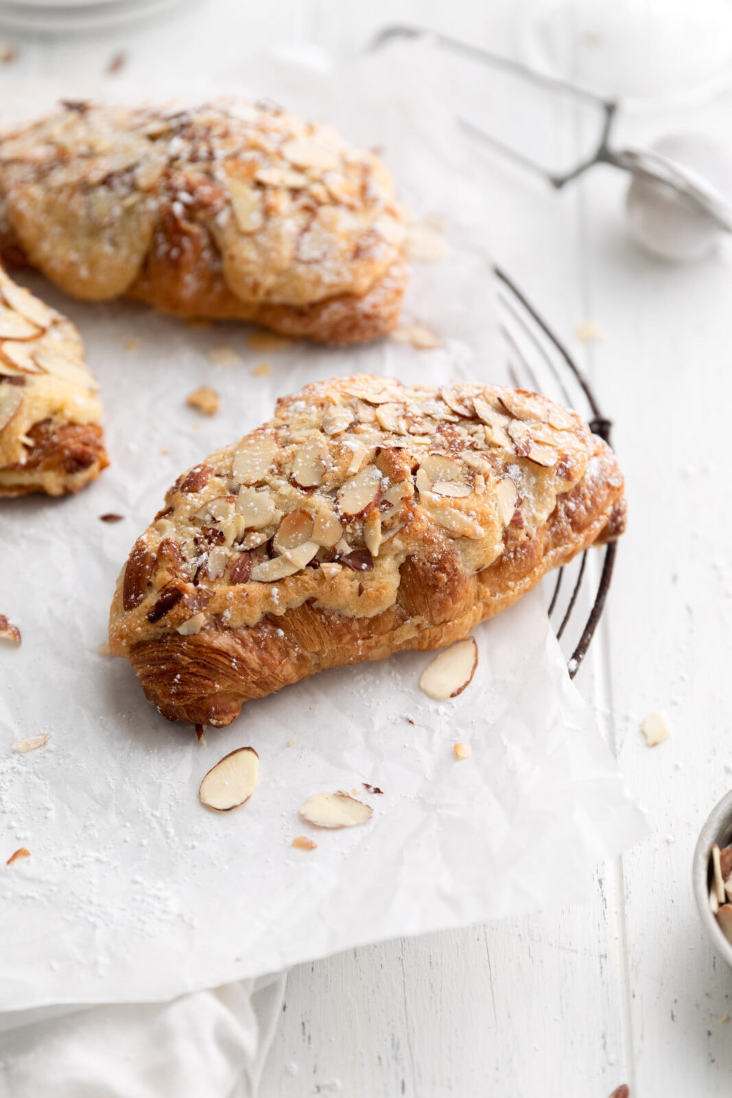 almond croissants on a cooling rack
