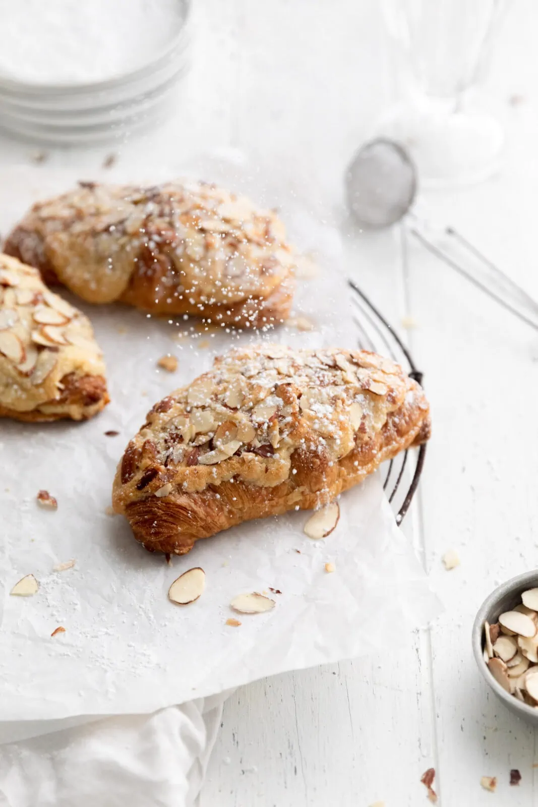 almond croissants with powdered sugar on top