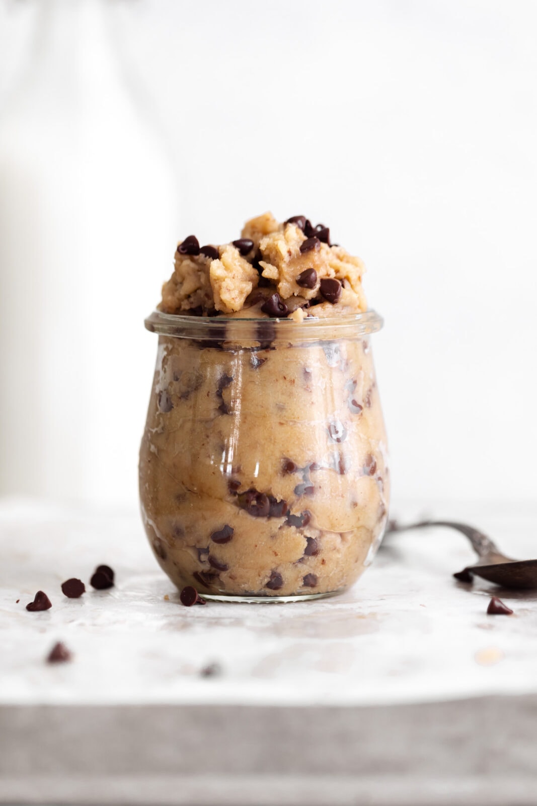 edible cookie dough with chocolate chips in a jar