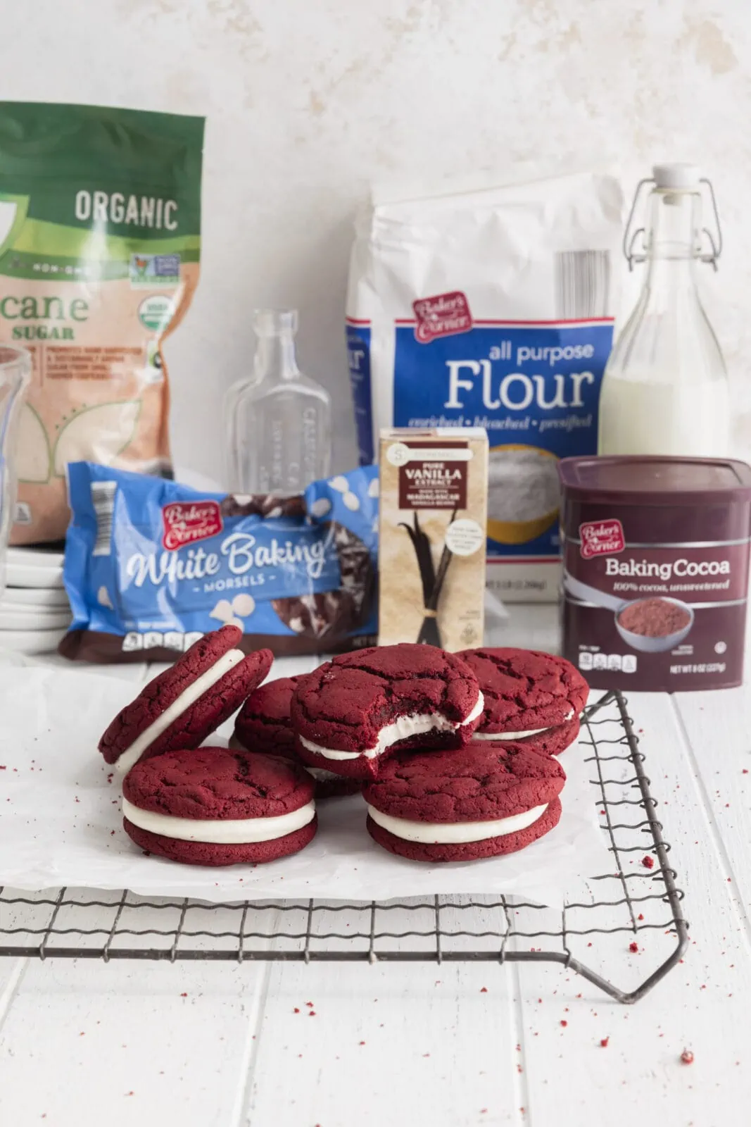 red velvet sandwich cookies with white chocolate frosting