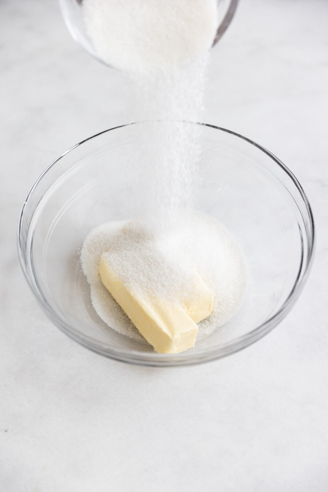 granulated sugar and butter in a bowl