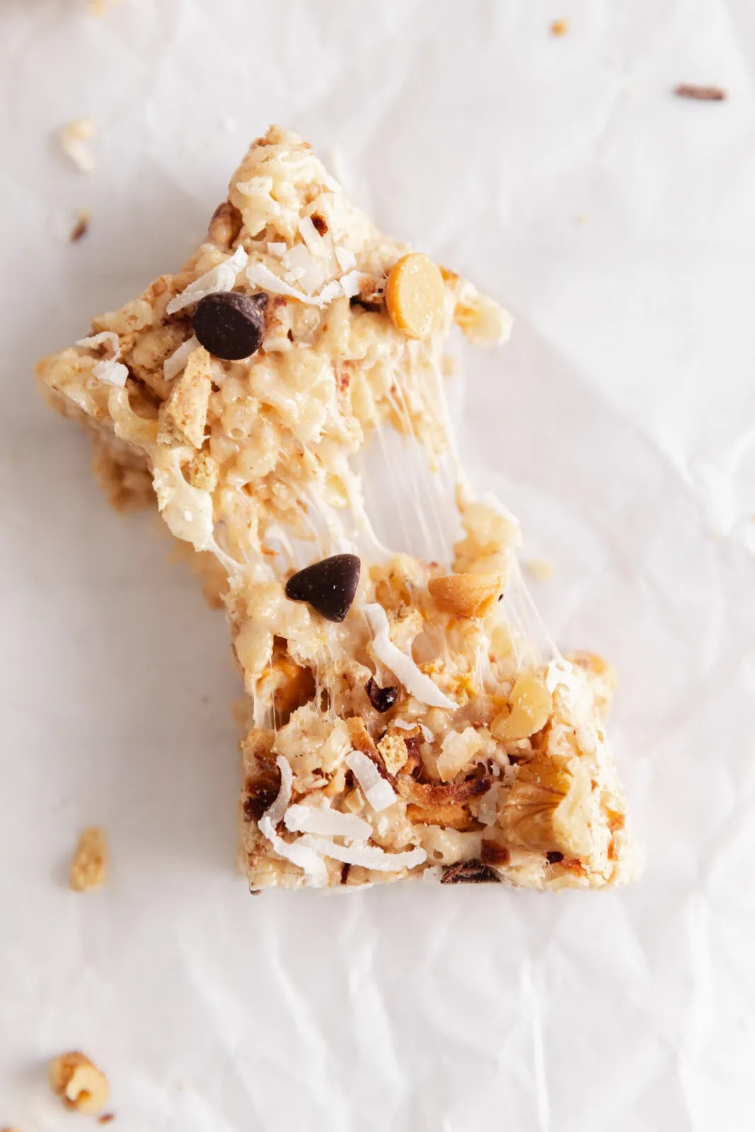 7 layer bar rice krispie treats with coconut, butterscotch, chocolate chips, and walnuts