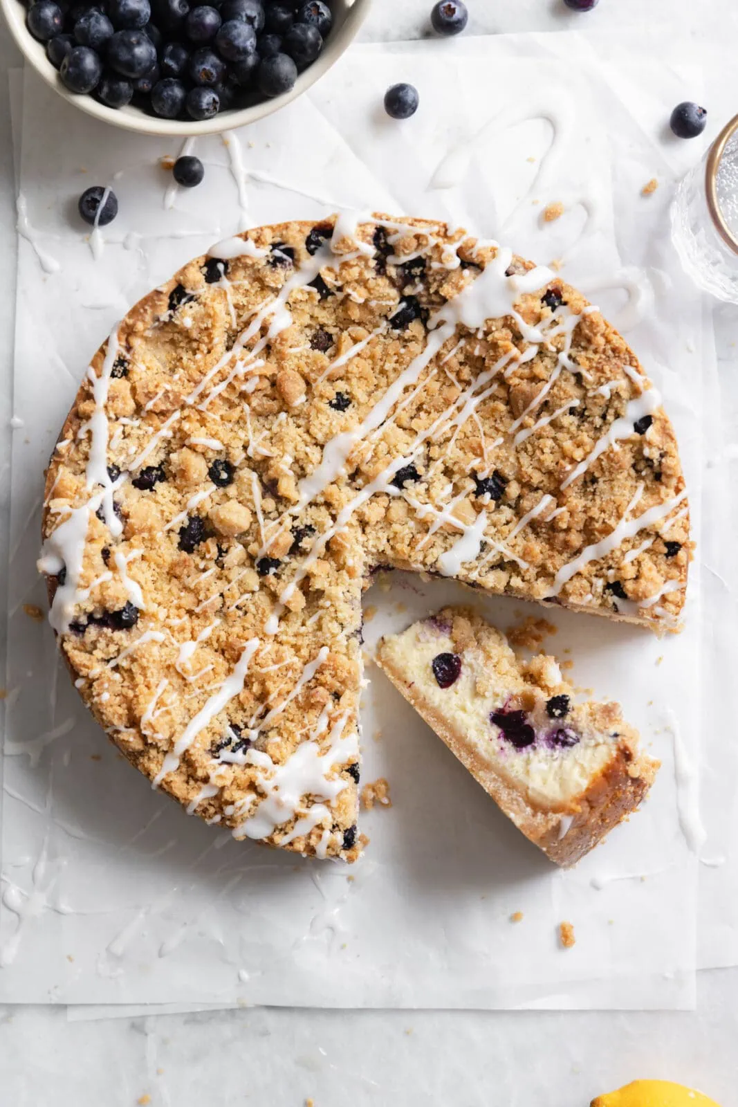 blueberry streusel cheesecake with vanilla glaze