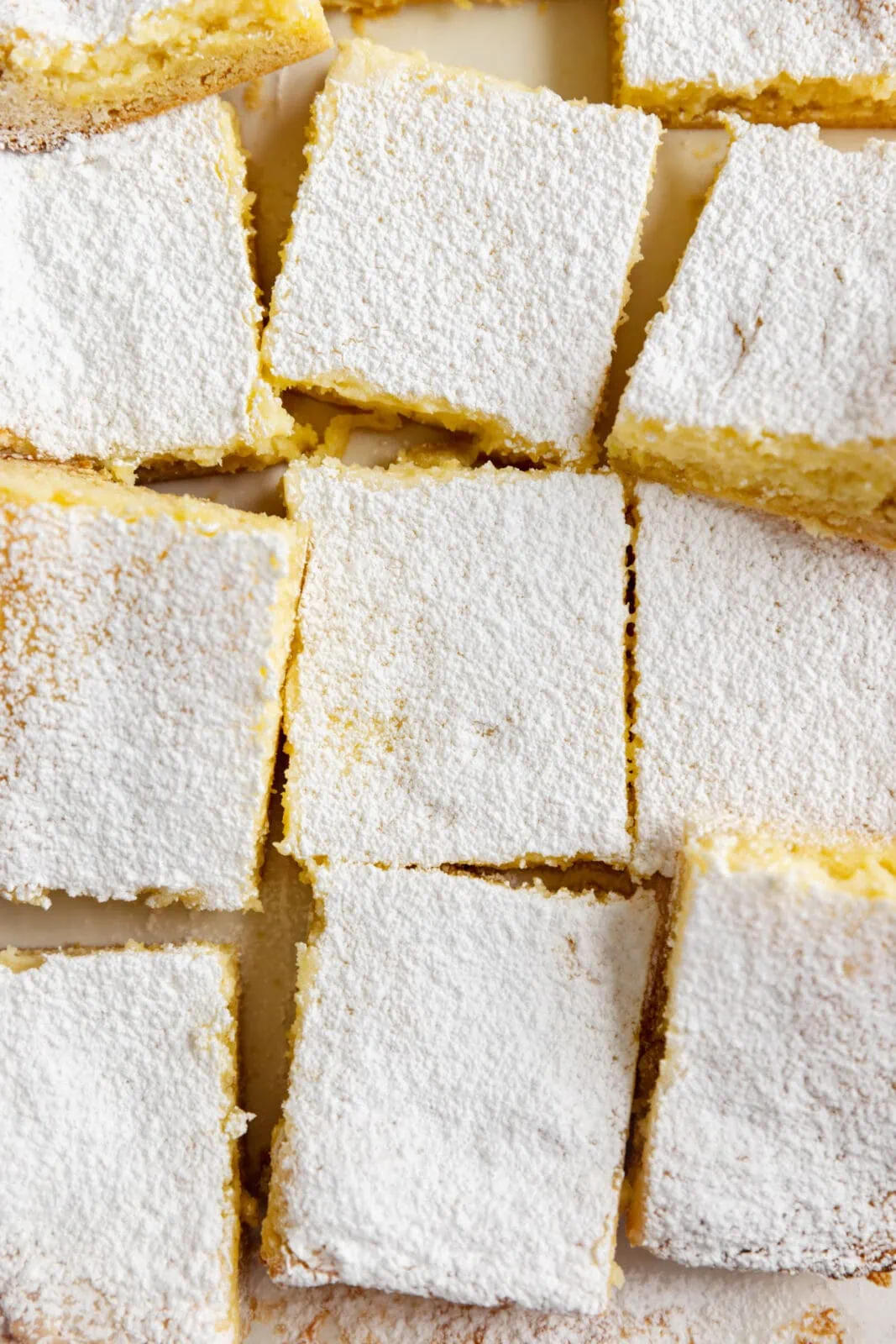 gooey lemon butter cake cut into squares