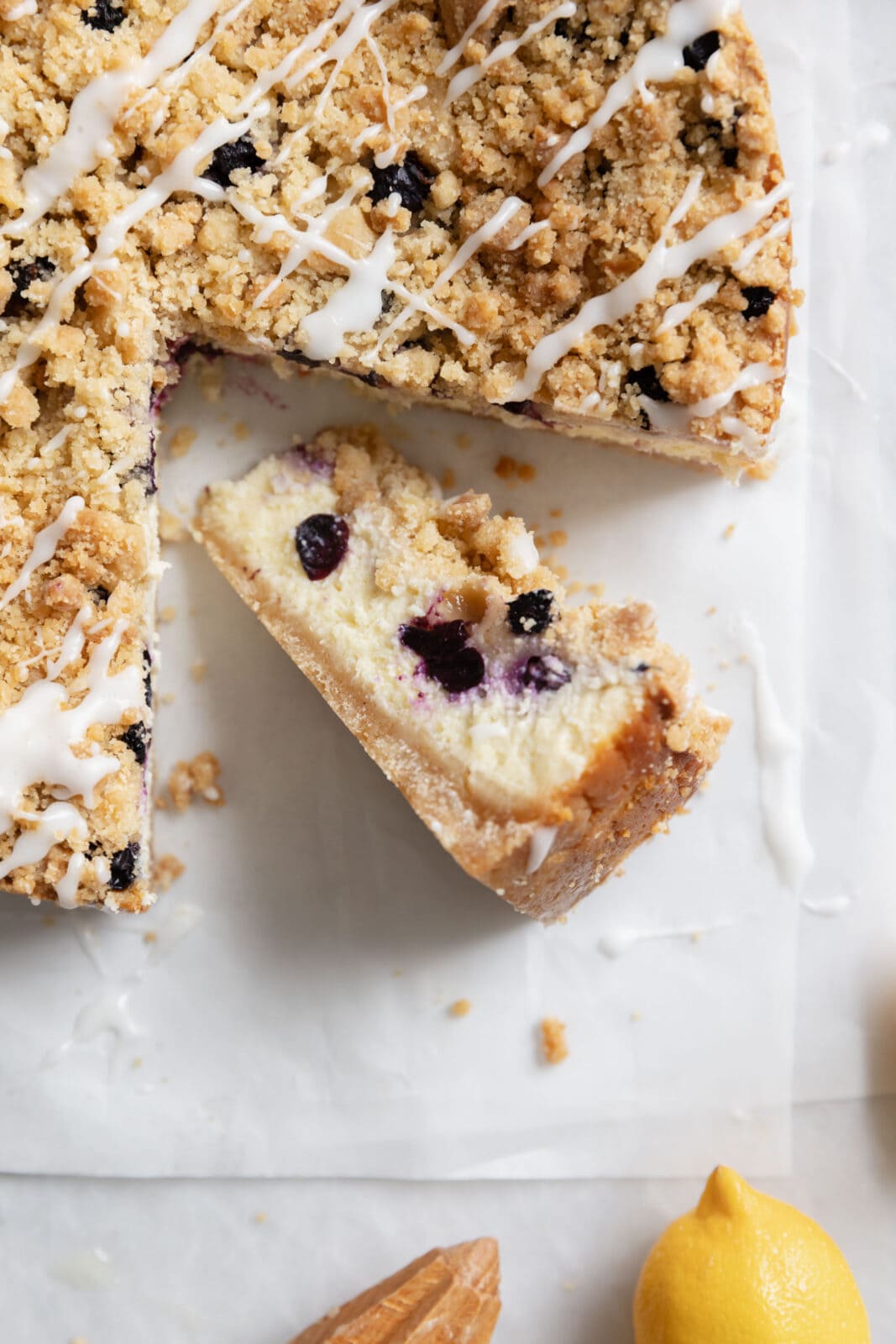 slice of blueberry crumble cheesecake with crumb topping