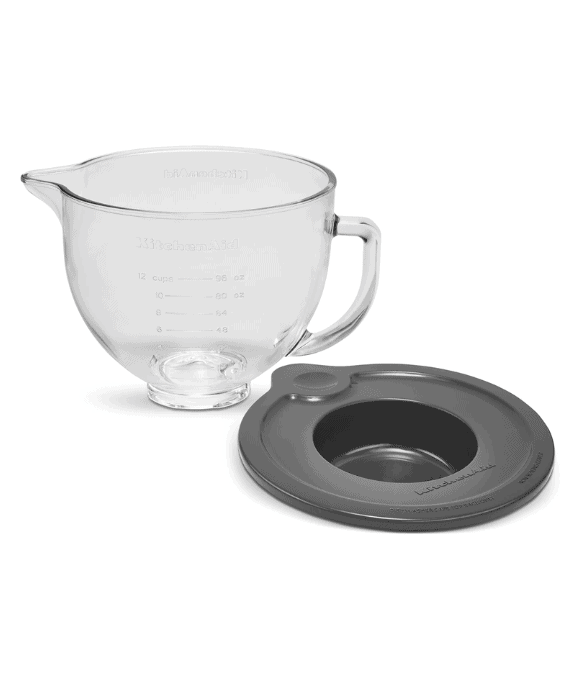 A glass KitchenAid stand mixer bowl with a grey plastic lid.
