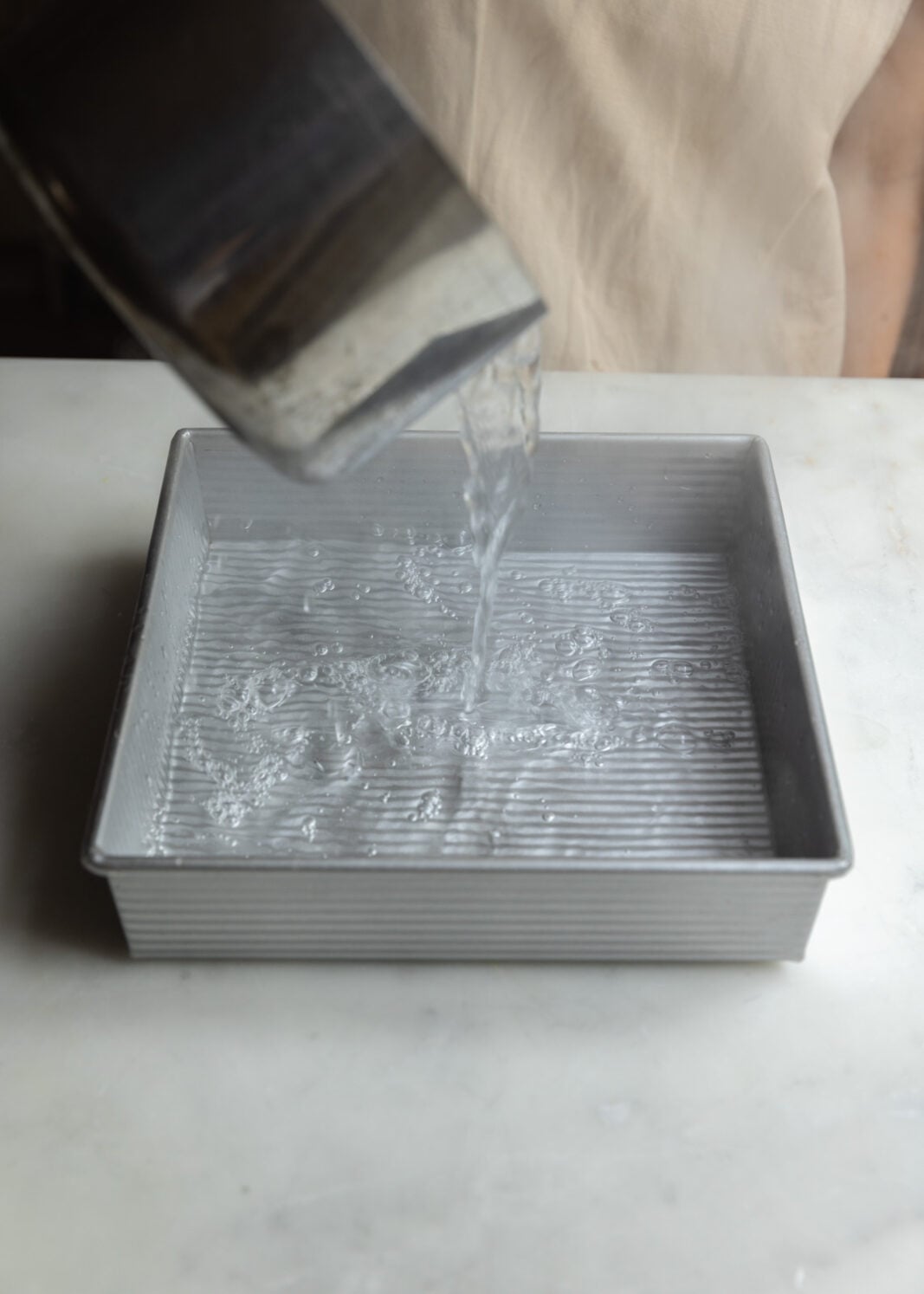 pour boiling water into a pan