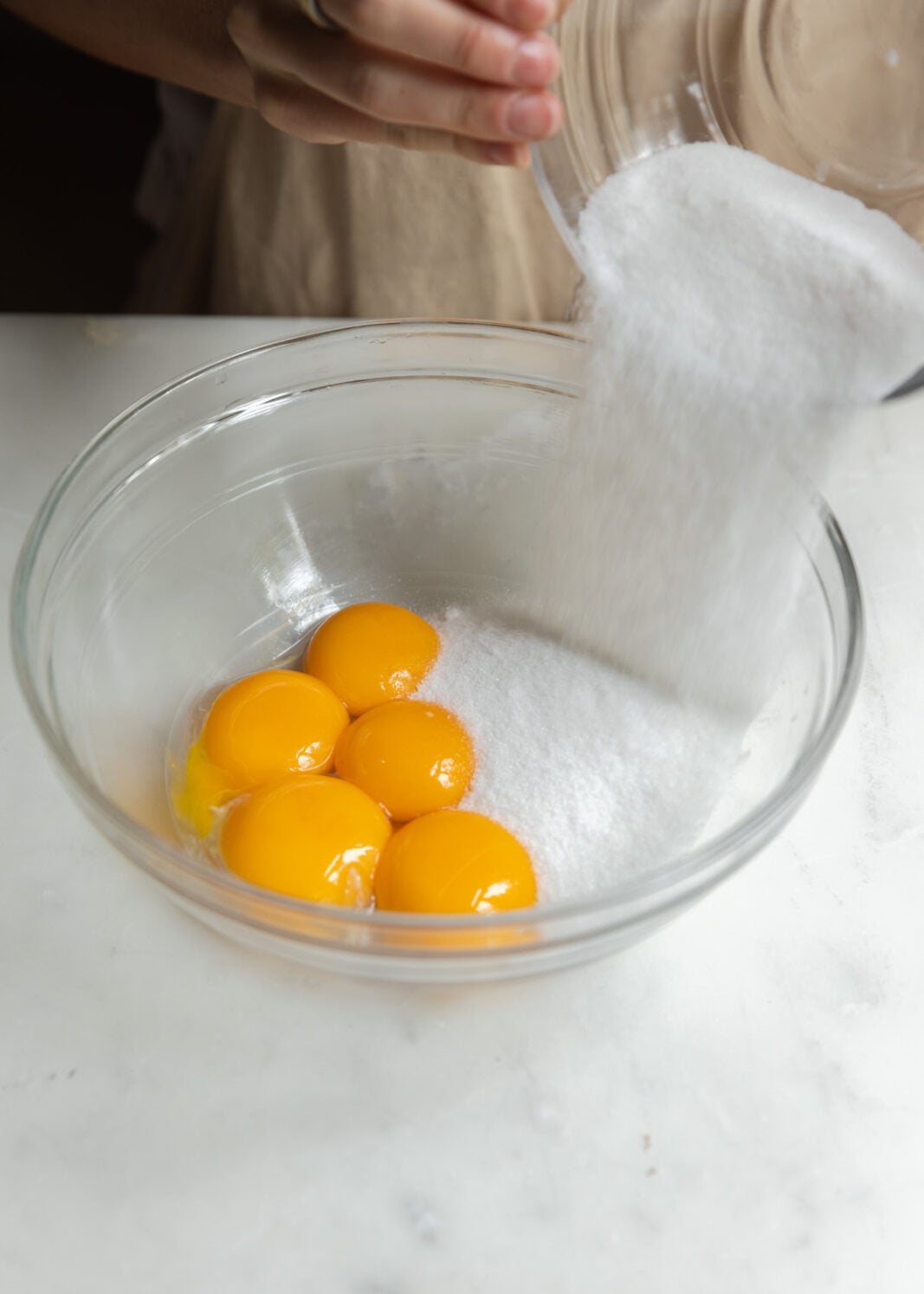 combine sugar and egg yolks