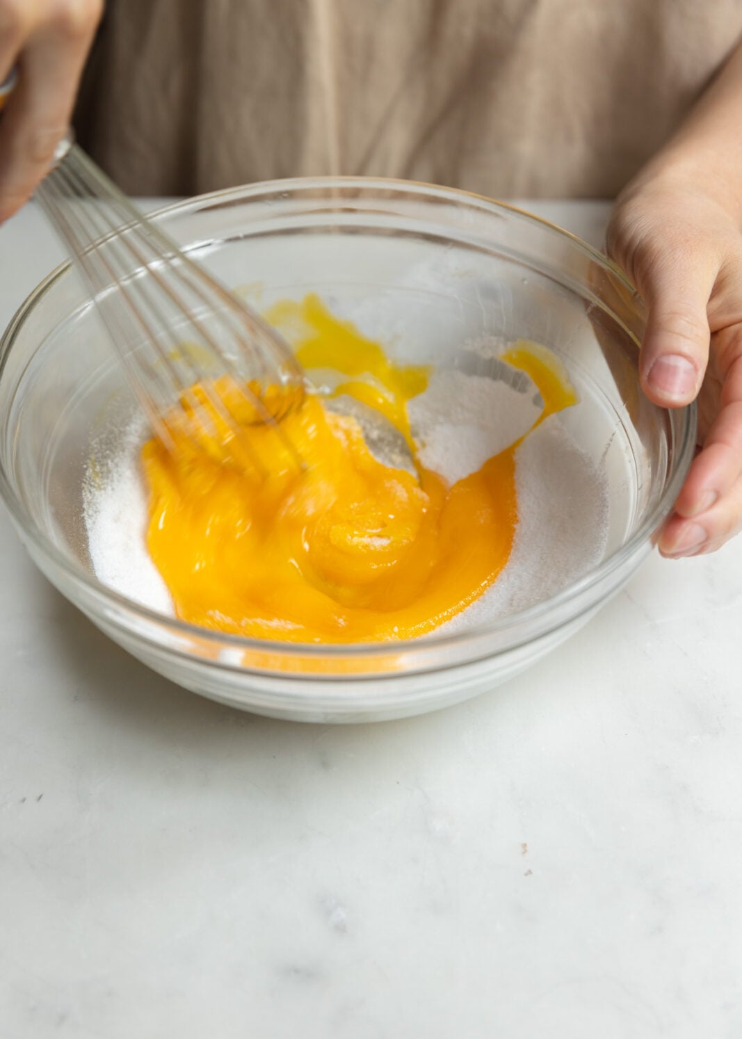 whisking egg yolks and sugar