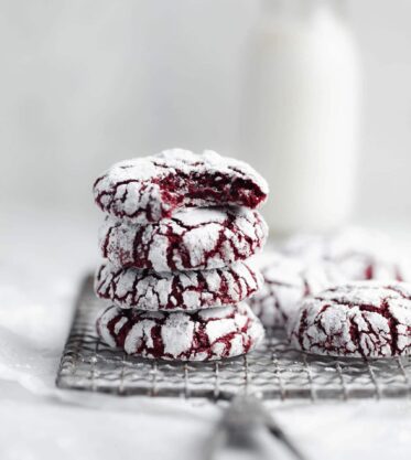 fudgy red velvet crinkle cookies coated in powdered sugar