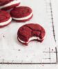 red velvet sandwich cookies with white chocolate frosting